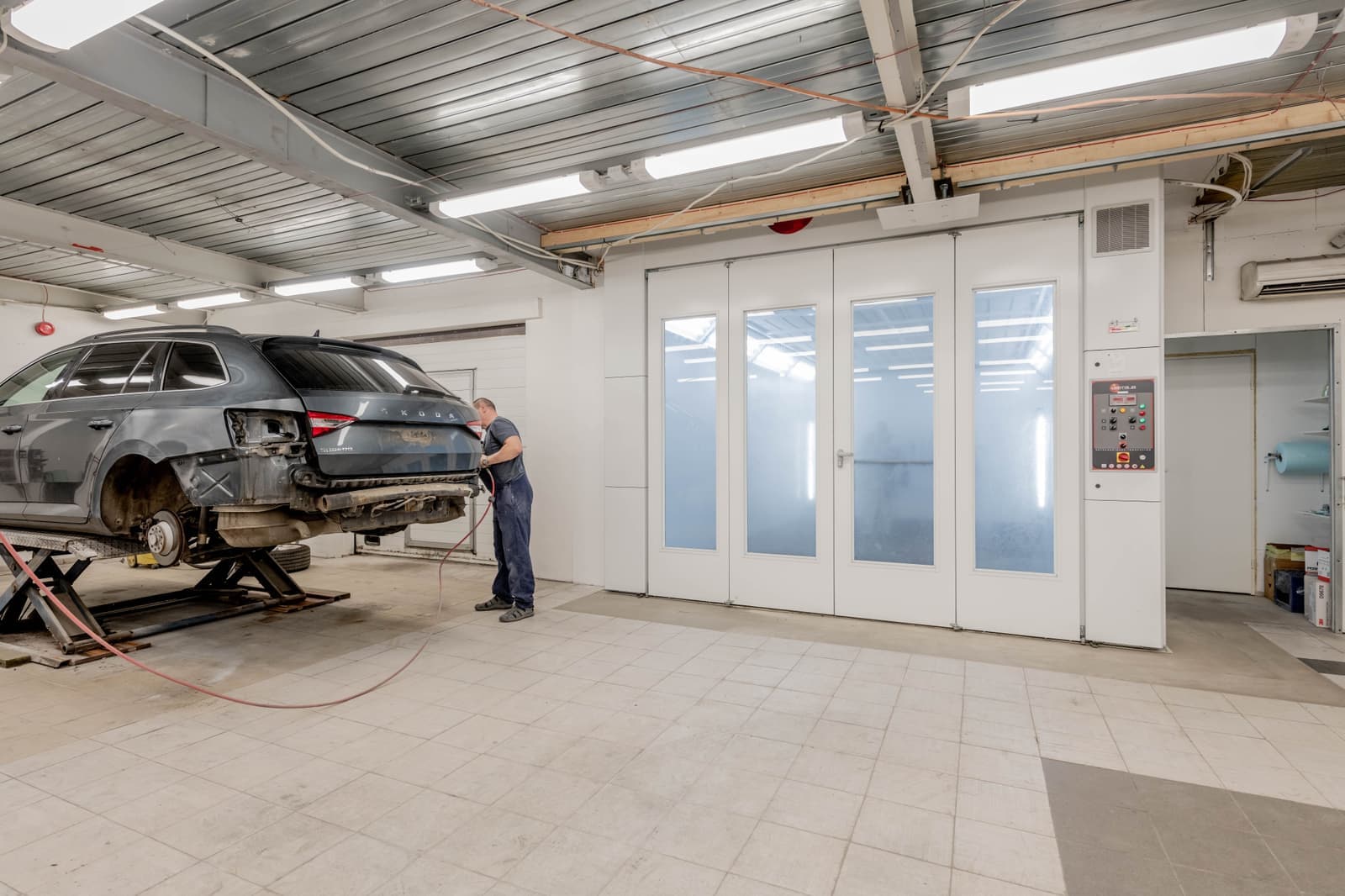 Car in a bodyshop paint booth