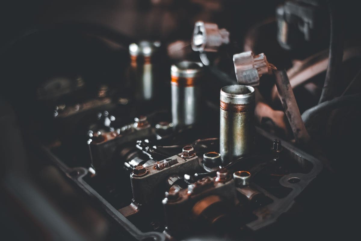 Close-up of engine components on a bench