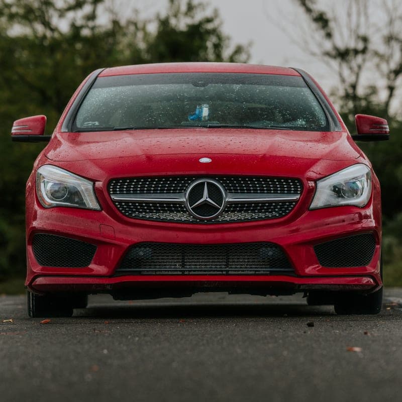 Front of a red prestige saloon car